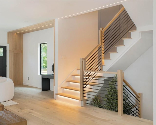 stairway with hardwood / wood-style flooring