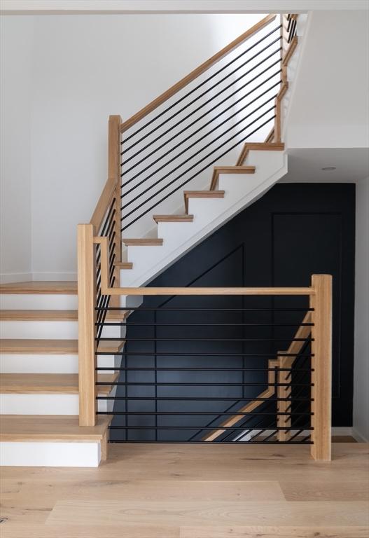 stairway featuring hardwood / wood-style floors