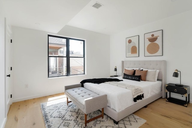 bedroom with light hardwood / wood-style flooring