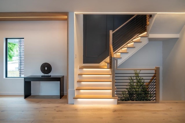 staircase featuring hardwood / wood-style flooring