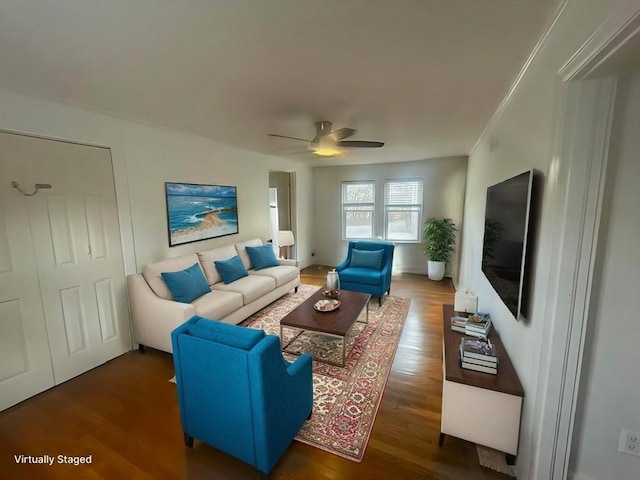 living room featuring ceiling fan and wood finished floors