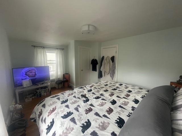 bedroom with wood finished floors