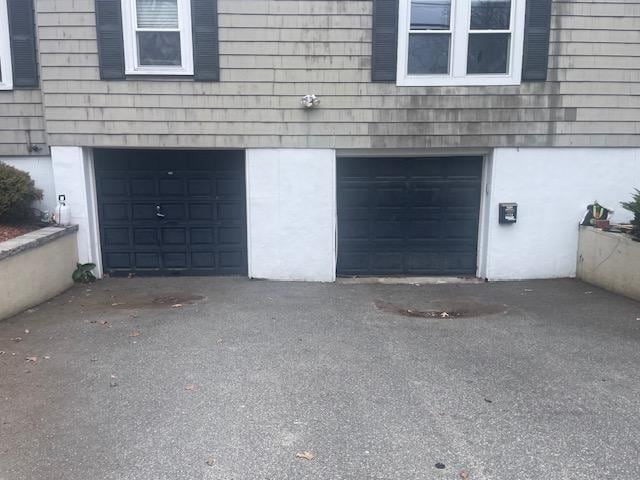 garage featuring driveway