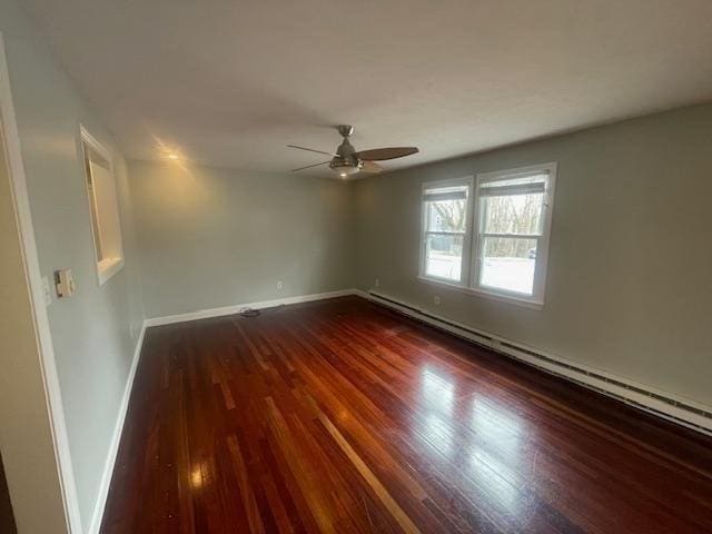unfurnished room with a baseboard radiator, a ceiling fan, baseboards, and dark wood finished floors