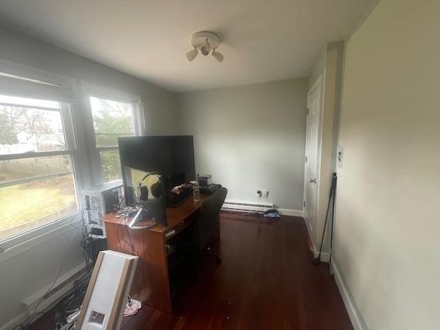 office area featuring dark wood-style flooring, baseboards, and baseboard heating