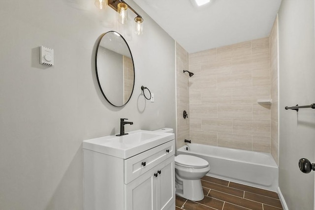 bathroom featuring vanity, wood finish floors, toilet, and shower / tub combination