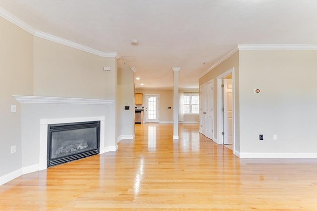 unfurnished living room featuring light wood-type flooring and crown molding