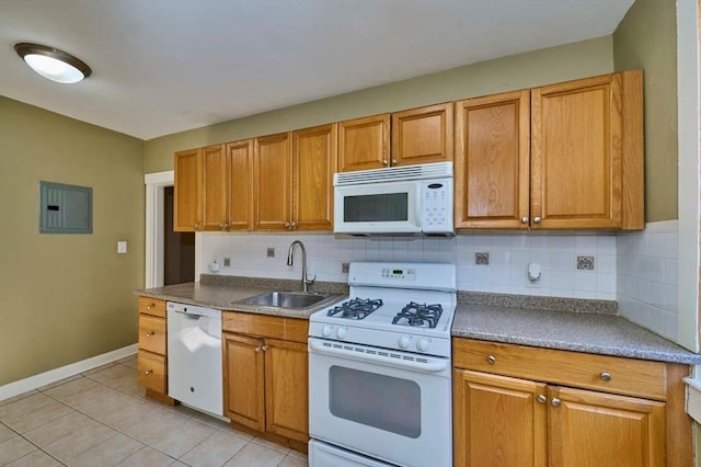 kitchen featuring white appliances, electric panel, tasteful backsplash, and sink