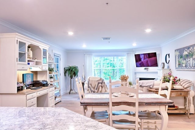 11 Cushing Pl Unit 106, Chelmsford, MA 01824 - dining space featuring crown molding, light wood-style flooring, recessed lighting, and baseboards