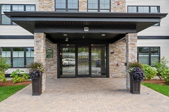 11 Cushing Pl Unit 106, Chelmsford, MA 01824 - property entrance featuring stone siding