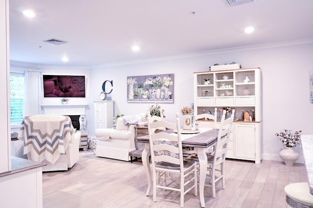 11 Cushing Pl Unit 106, Chelmsford, MA 01824 - dining area with light wood-style floors, crown molding, and recessed lighting