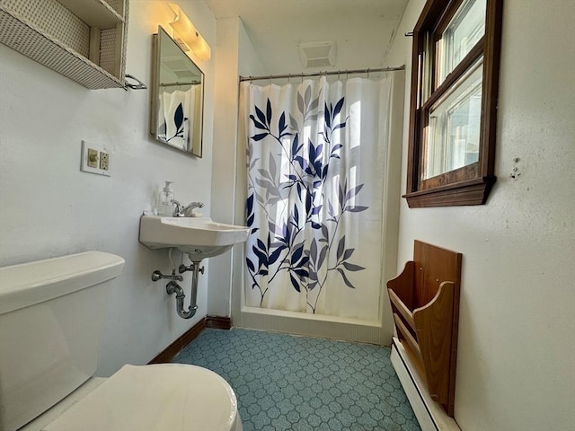 bathroom with toilet, a baseboard heating unit, and a shower with shower curtain