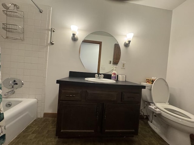 full bathroom featuring vanity, tiled shower / bath combo, and toilet