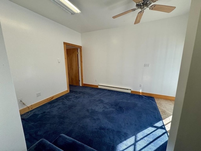 carpeted spare room with baseboard heating and ceiling fan