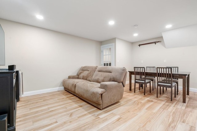 living area with recessed lighting, light wood-style flooring, and baseboards