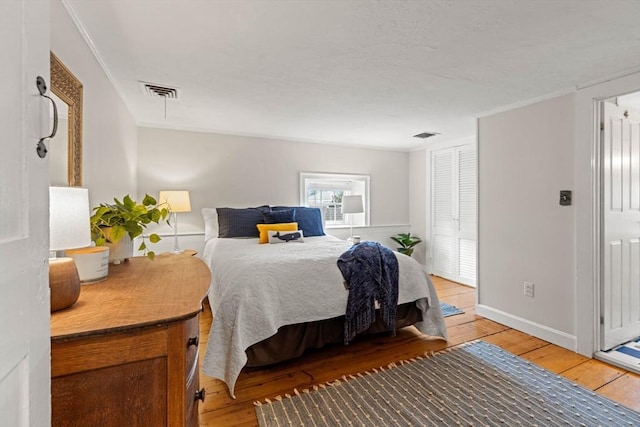 218 Washington St Unit 5, Marblehead, MA 01945 - bedroom with light wood finished floors, crown molding, and baseboards