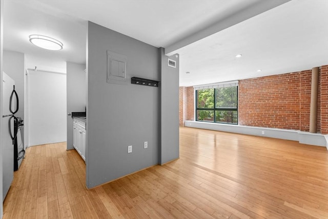 42 8th St Unit 1301, Boston, MA 02129 - hall with light wood-type flooring and brick wall
