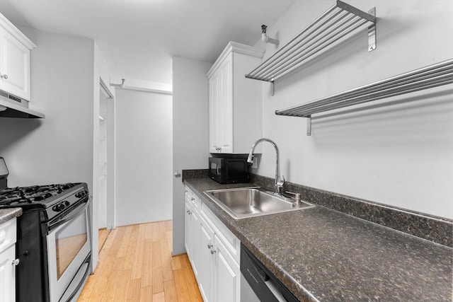 42 8th St Unit 1301, Boston, MA 02129 - kitchen with stainless steel range with gas stovetop, a sink, under cabinet range hood, and white cabinets