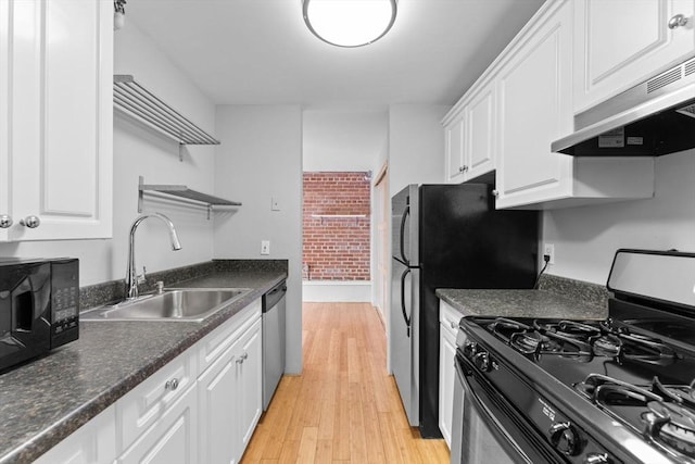42 8th St Unit 1301, Boston, MA 02129 - kitchen featuring stainless steel appliances, a sink, white cabinets, and dark countertops