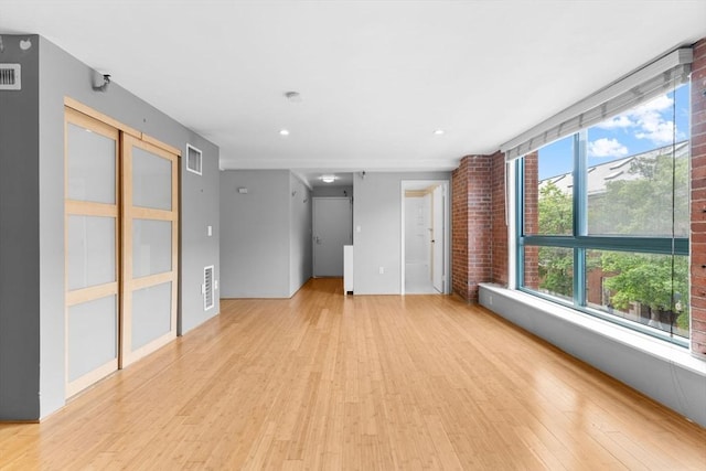 42 8th St Unit 1301, Boston, MA 02129 - unfurnished living room with light wood-style floors and recessed lighting