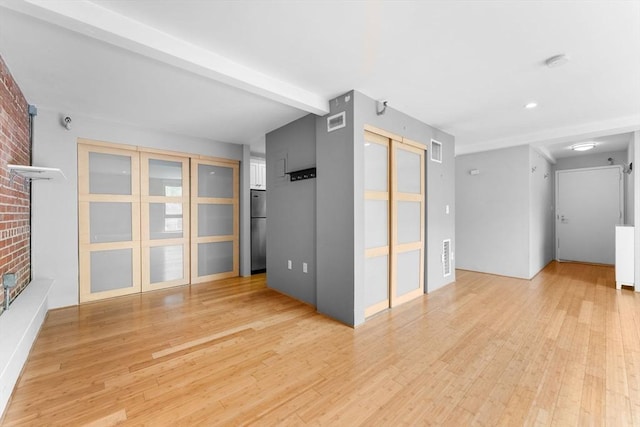 42 8th St Unit 1301, Boston, MA 02129 - unfurnished room featuring light wood-type flooring, beam ceiling, and recessed lighting