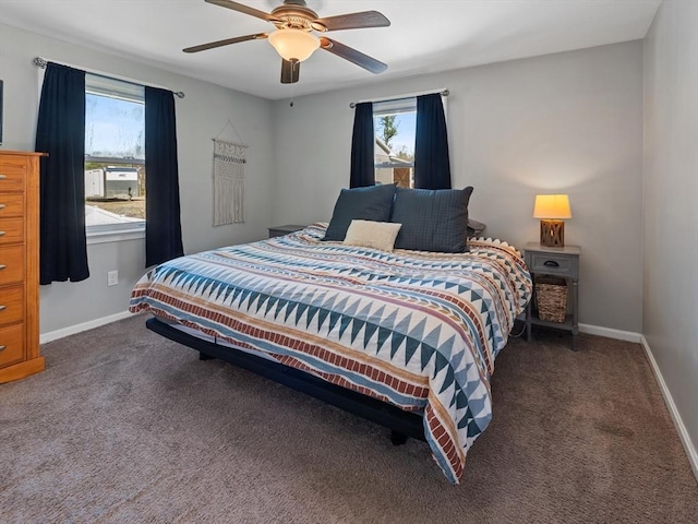 carpeted bedroom featuring a ceiling fan and baseboards