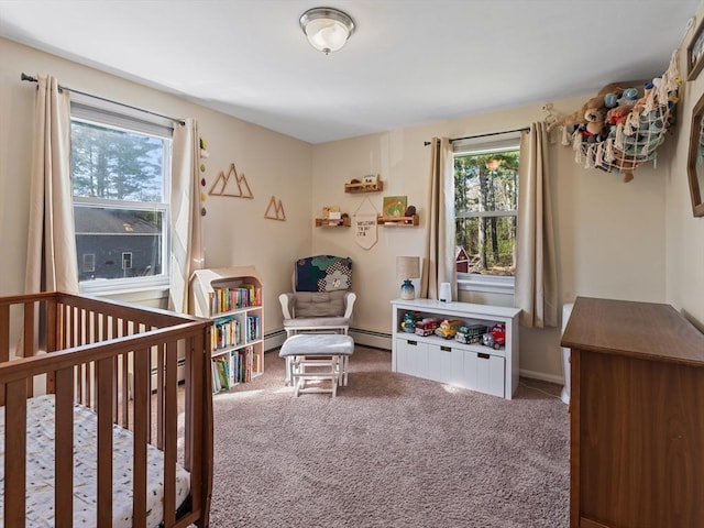 bedroom featuring carpet, a crib, and baseboard heating