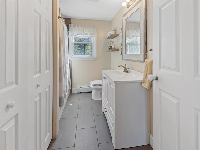 bathroom featuring curtained shower, vanity, a baseboard radiator, tile patterned floors, and toilet