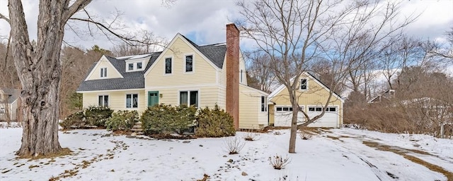 view of snow covered exterior with a garage