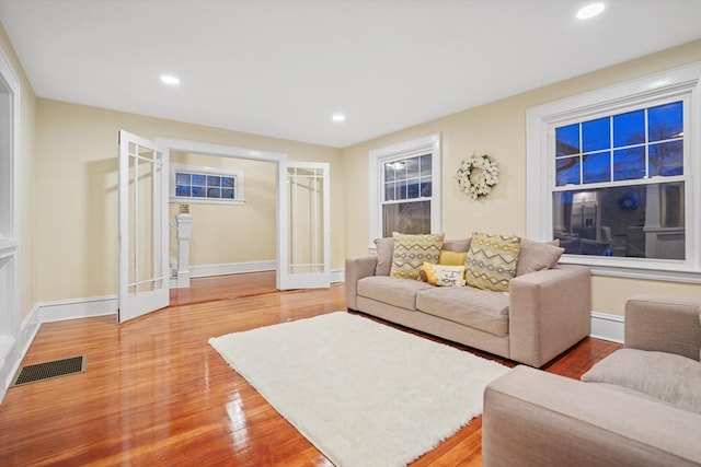 living room featuring hardwood / wood-style floors and french doors