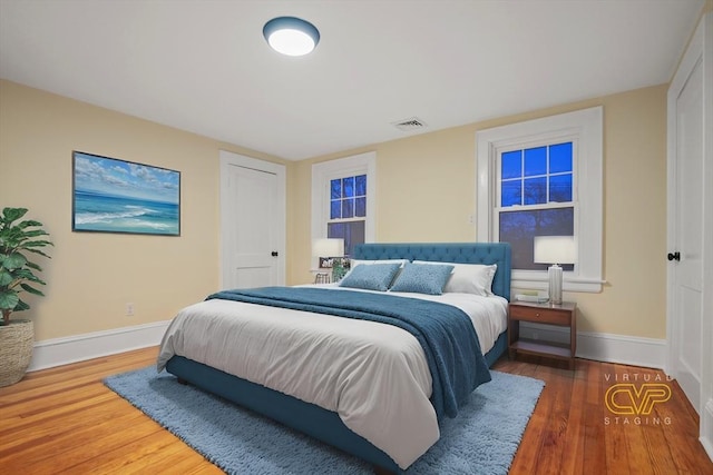 bedroom featuring dark hardwood / wood-style flooring