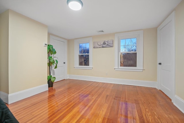 spare room with wood-type flooring