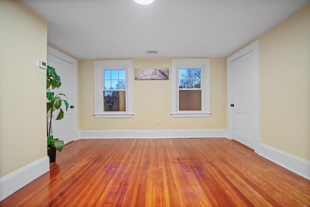 empty room featuring hardwood / wood-style flooring