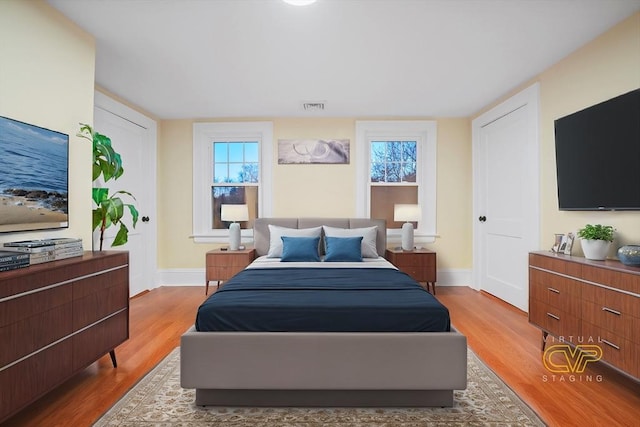 bedroom with light hardwood / wood-style flooring