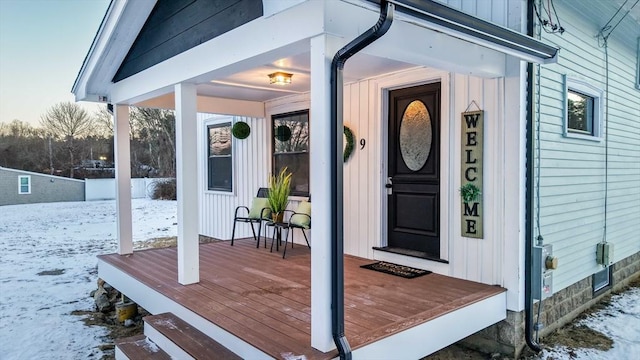 view of snow covered property entrance