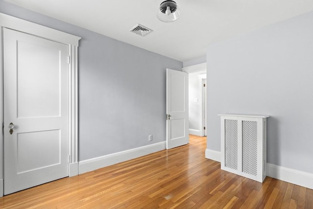 unfurnished bedroom featuring hardwood / wood-style floors