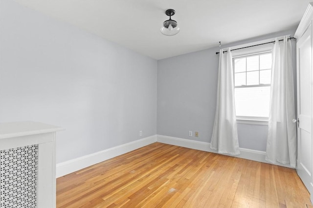 spare room featuring light wood-type flooring