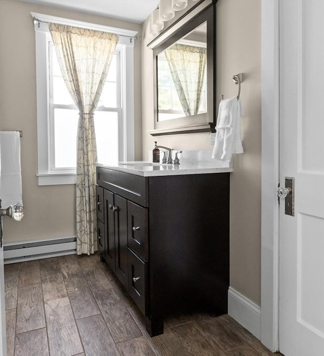 bathroom featuring vanity and a baseboard radiator