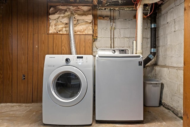 clothes washing area featuring washer and clothes dryer