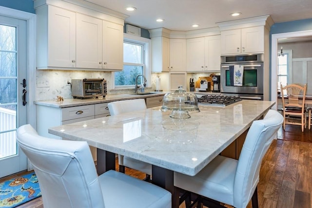 262 Homestead Ave, Rehoboth, MA 02769 - kitchen featuring a kitchen bar, white cabinets, dark wood-style flooring, light stone countertops, and recessed lighting