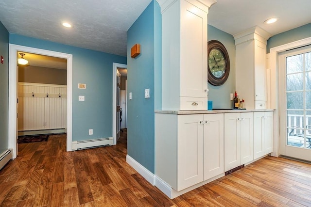 262 Homestead Ave, Rehoboth, MA 02769 - hallway featuring a baseboard heating unit, wood finished floors, and recessed lighting