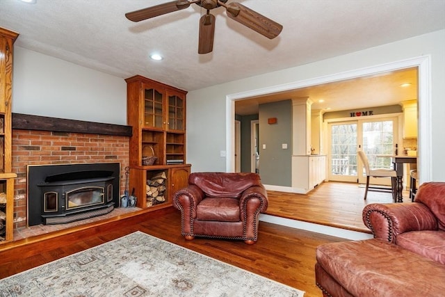 262 Homestead Ave, Rehoboth, MA 02769 - living room featuring ceiling fan, wood finished floors, recessed lighting, and a wood stove