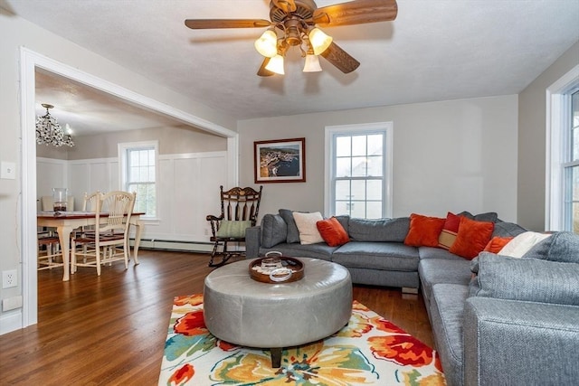 262 Homestead Ave, Rehoboth, MA 02769 - living room featuring dark wood finished floors, healthy amount of natural light, a chandelier, and ceiling fan