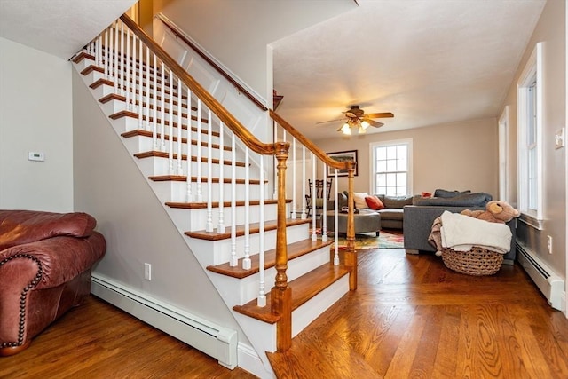 262 Homestead Ave, Rehoboth, MA 02769 - stairway featuring a baseboard radiator, ceiling fan, and wood finished floors