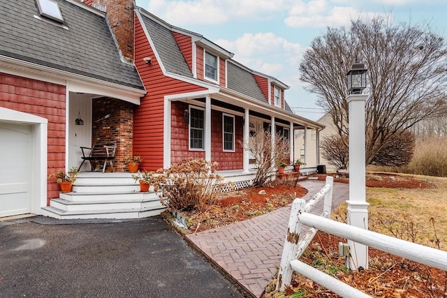 262 Homestead Ave, Rehoboth, MA 02769 - view of front of home featuring a porch, roof with shingles, and a chimney