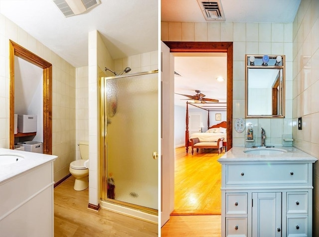 262 Homestead Ave, Rehoboth, MA 02769 - ensuite bathroom with tile walls, vanity, a stall shower, wood finished floors, and ceiling fan