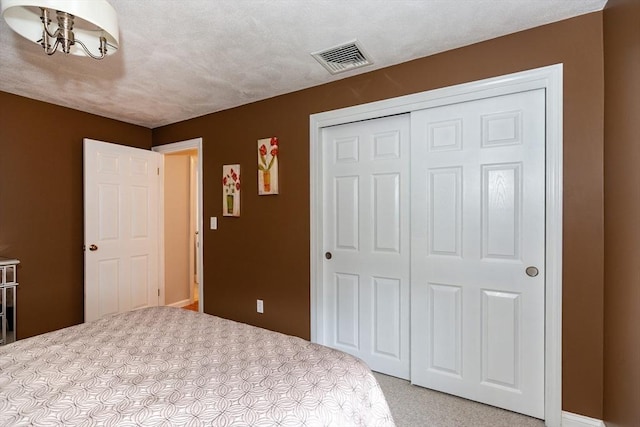 262 Homestead Ave, Rehoboth, MA 02769 - unfurnished bedroom featuring light carpet, a closet, and a chandelier
