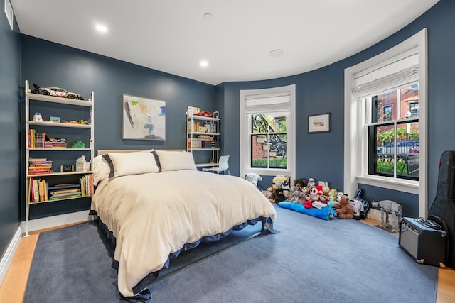 bedroom with wood-type flooring