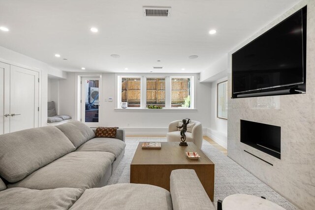 30 Concord Sq Unit 1, Boston, MA 02118 - living room featuring a premium fireplace, recessed lighting, visible vents, and baseboards