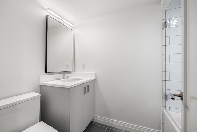 full bathroom with vanity, toilet, tiled shower / bath combo, and tile patterned flooring